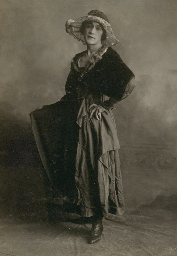 Photo of Geraldine Portica in a dress and wide brimmed hat