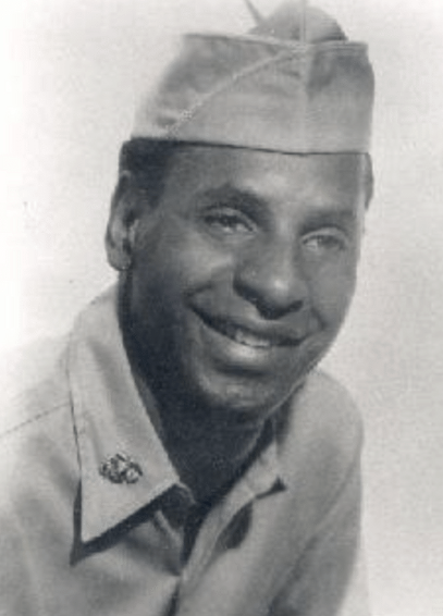Black and white photo of a Black man in a soldier uniform
