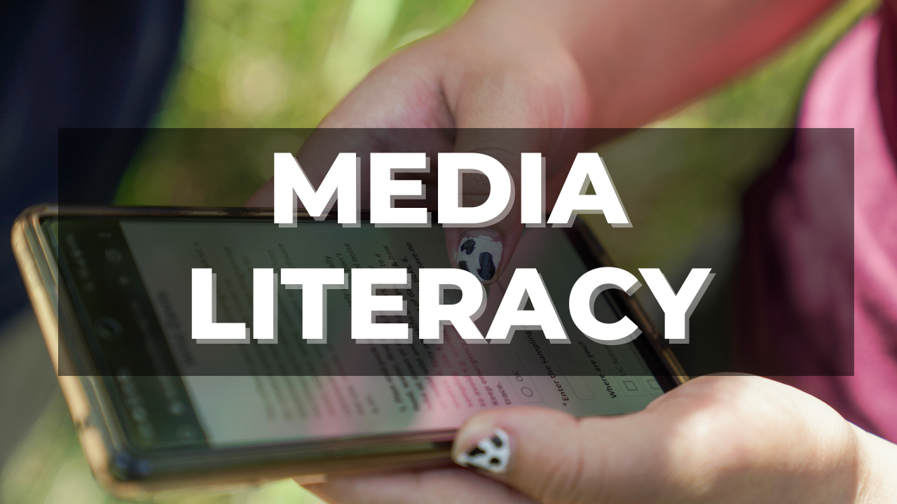 Color image of a person typing on a black phone with the words "Medial Literacy" overlaid