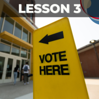 Color photo of a sign that says "Vote Here"